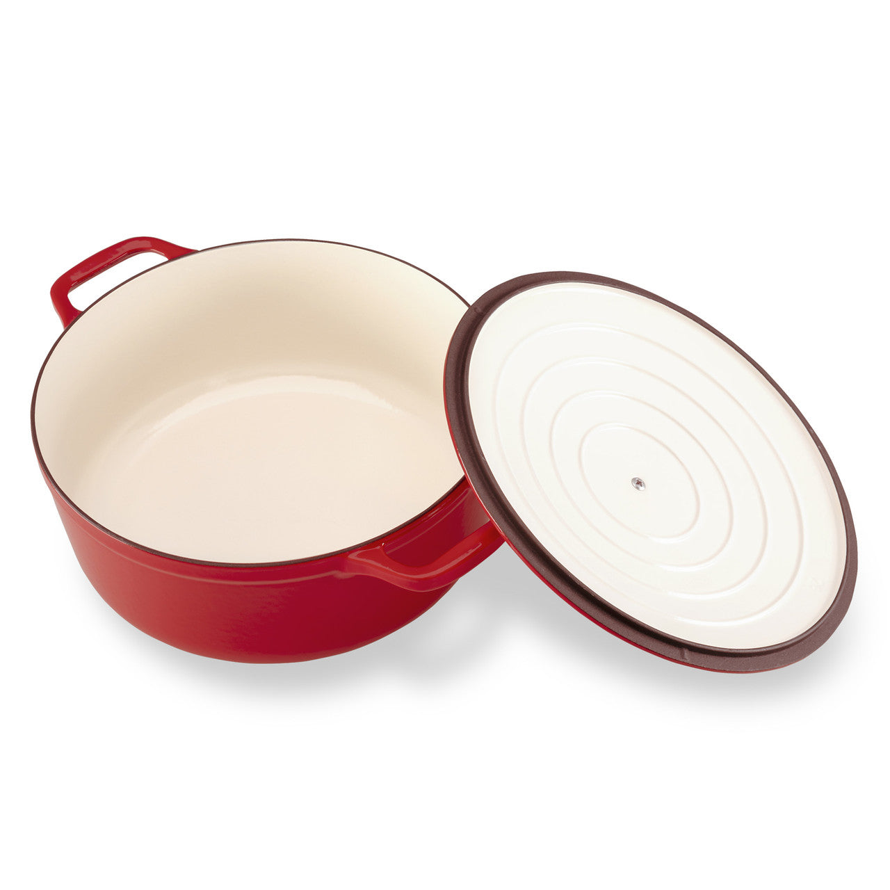 Red enameled cast iron Dutch oven with a white interior on a white background