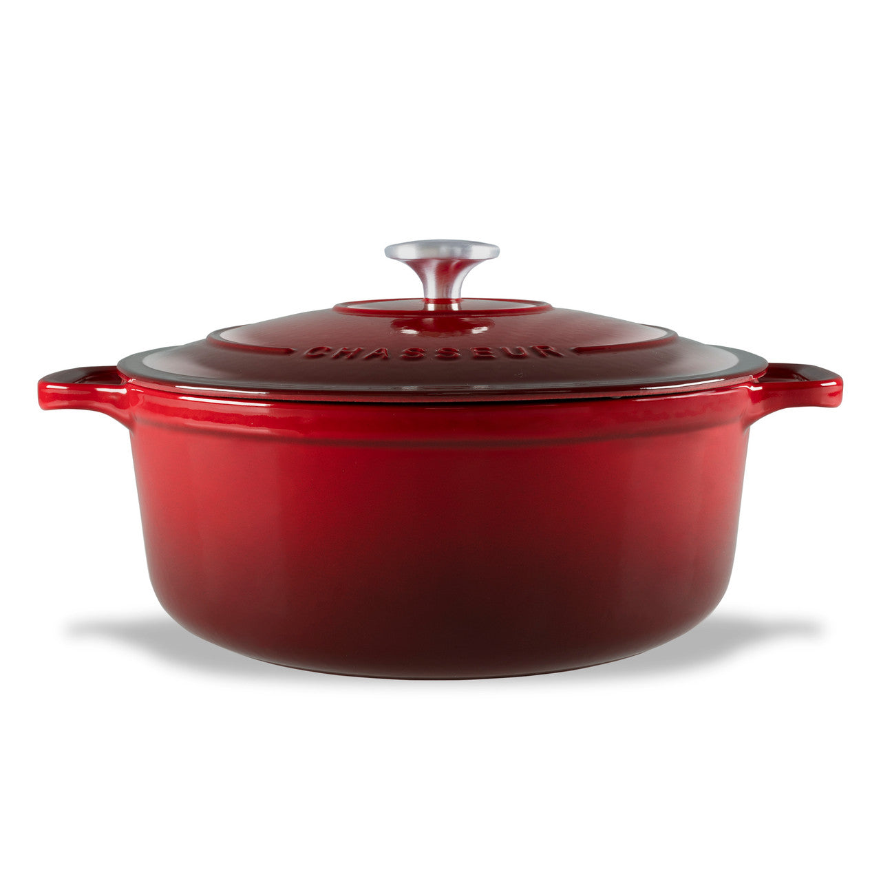 Red enameled cast iron Dutch oven with a lid on a white background